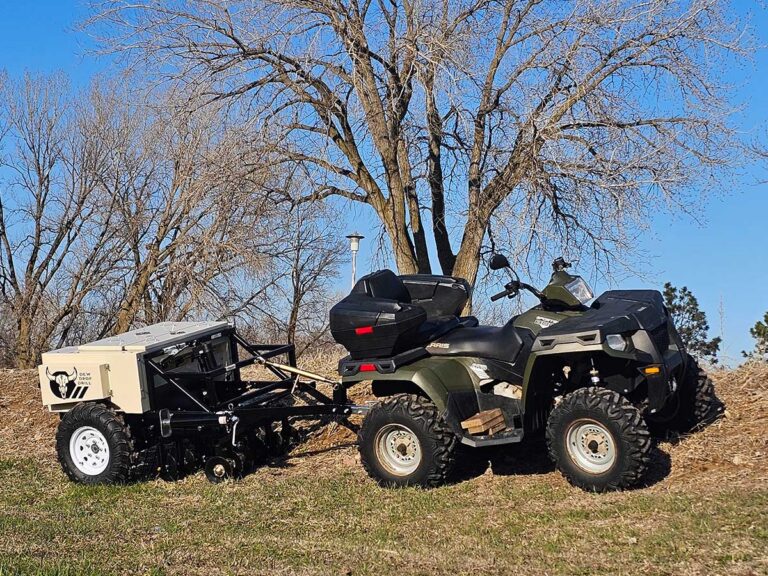 No-till food plot drill pulled by an ATV on sloped ground a tractor and disc cannot work